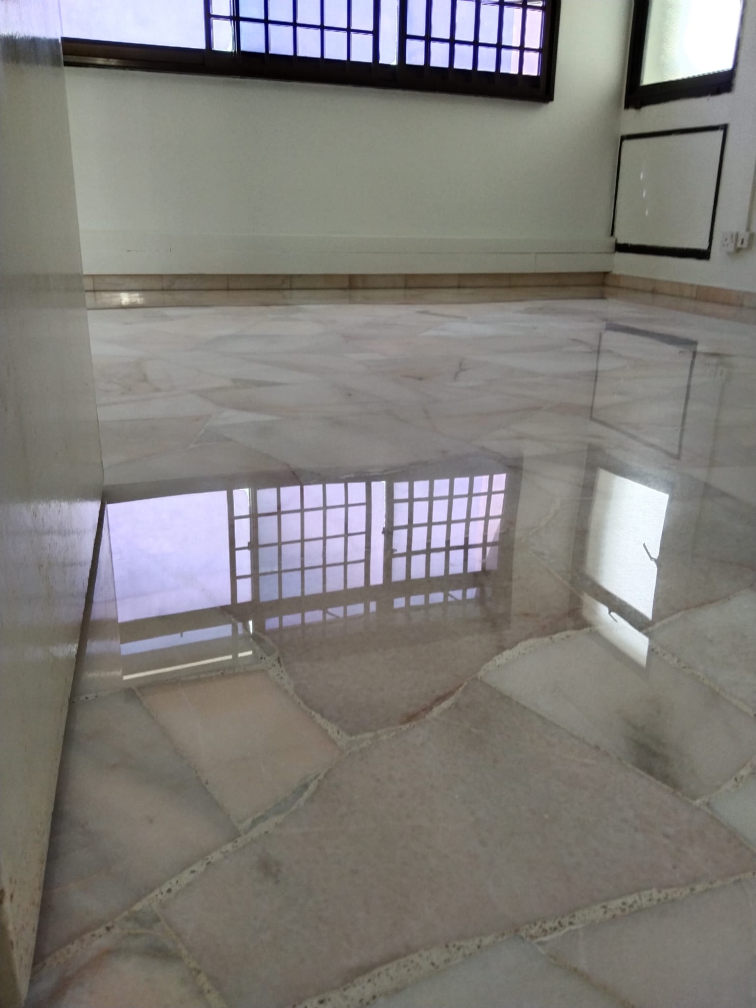 After marble polishing, cleaning and finishing view looks shiny on floor tiles