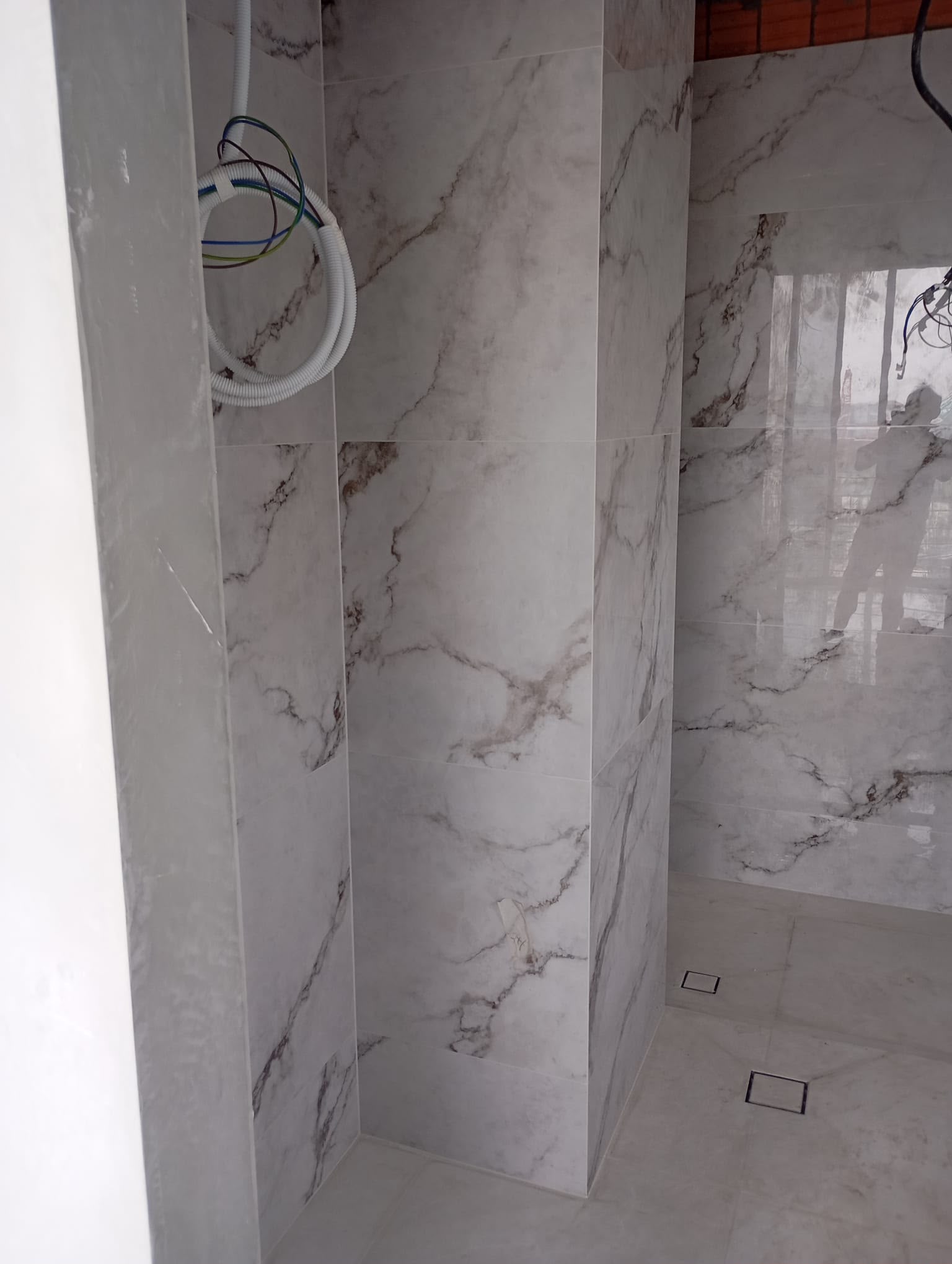 Toilet wall tile grouting